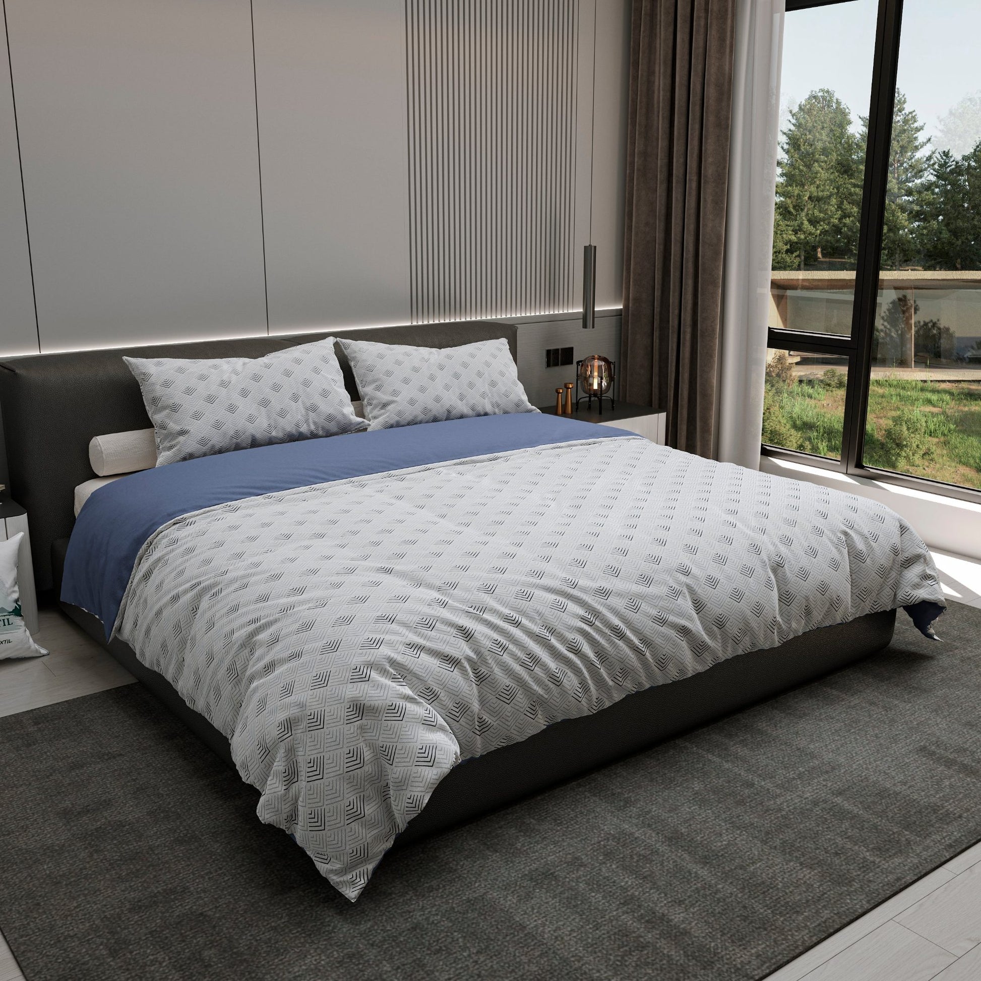 Edredón Vértice tendido en cama con cojines decorativos